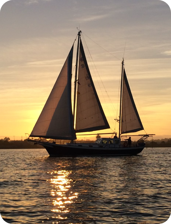 sail boat with a setting sun